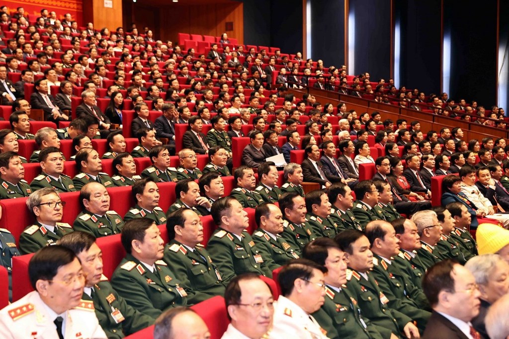 Representantes del Comité del Partido en el Ministerio de Defensa asisten a la sesión inaugural del XIII Congreso. (Foto: VNA)
